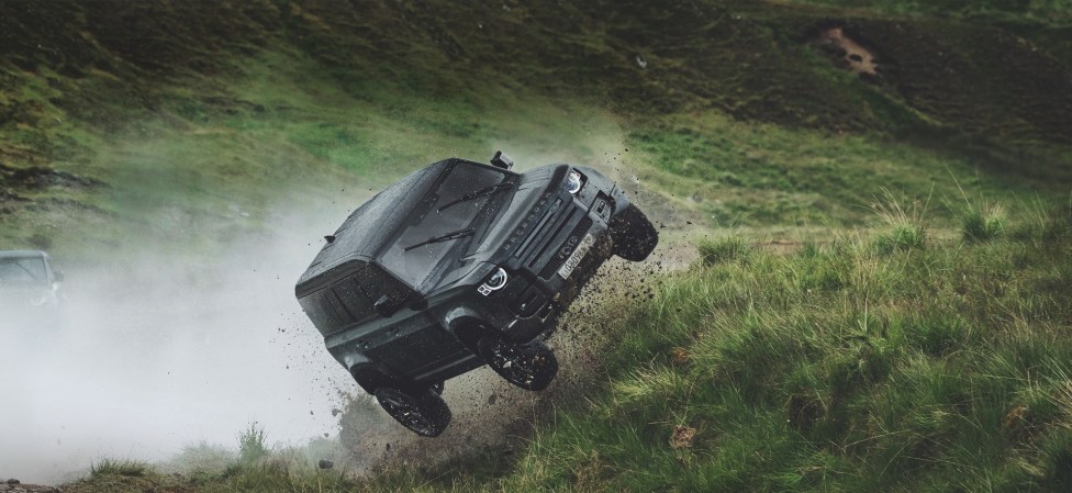 Watch 007’s <em>No Time to Die</em> Stunt Drivers Beat the Living Daylights Out of Land Rover Defenders