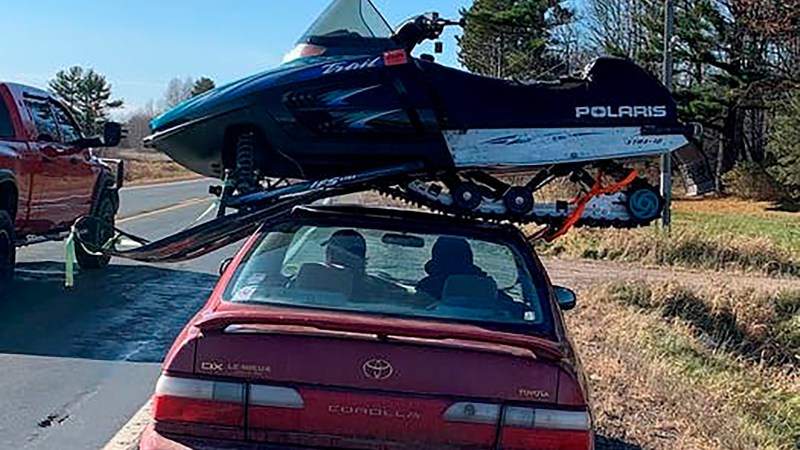 Toyota Corolla With Snowmobile on the Roof Proves Anything Can Be a Truck If You Want It to Be