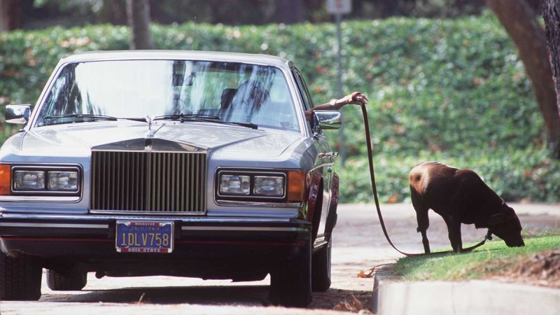 Please, Look at This Woman Walking Her Dog From a Rolls-Royce